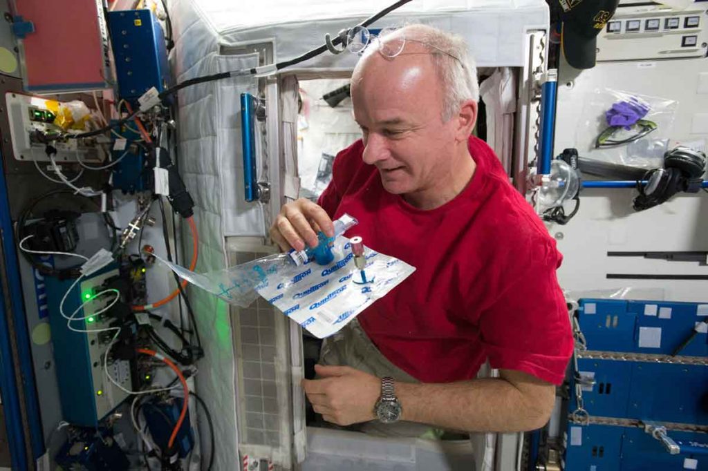 Astronaut Jeff Williams collects a breath sample for the MARROW experiment on board the International Space Station