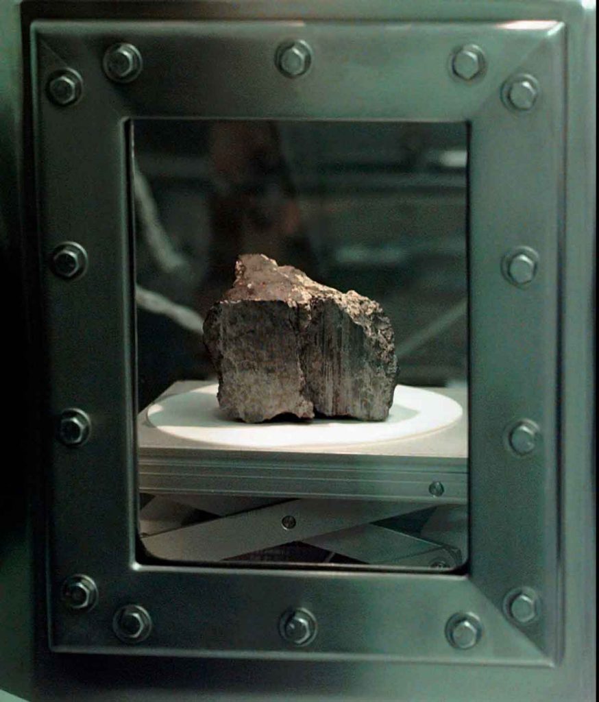 The meteorite labeled ALH84001 sits in a chamber at a Johnson Space Center lab in Houston