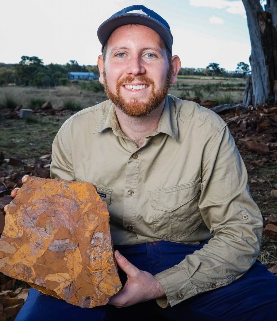 Dr McCurry with ancient fossils found in Australia