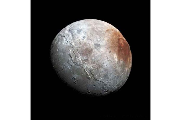 A new explanation for the reddish north pole of Pluto's moon Charon