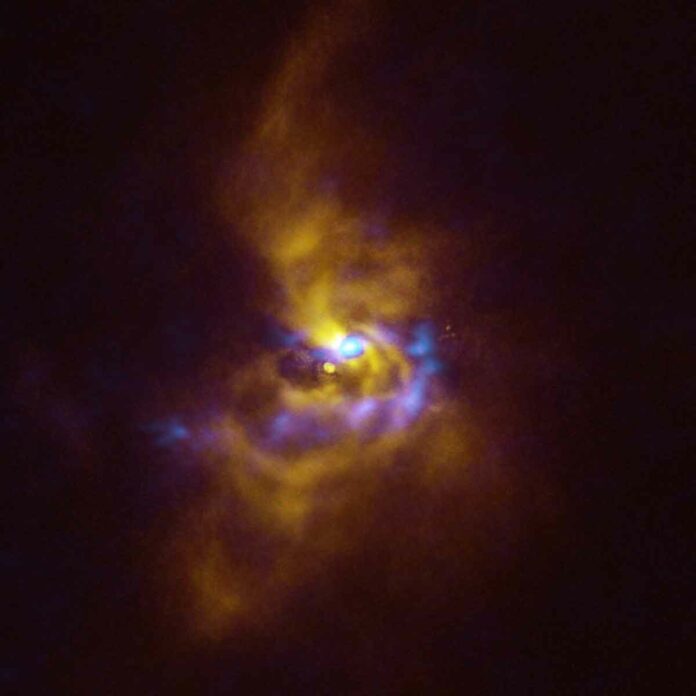 At the center of this image is the young star V960 Mon